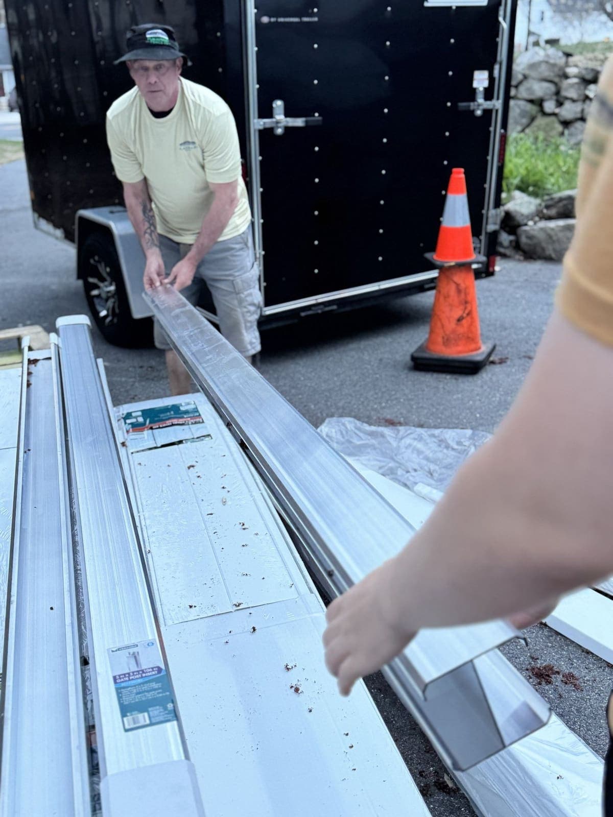 Unloading vinyl fence materials from the trailer